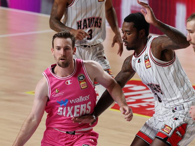 Mitch McCarron of the 36ers and Gary Clark of the Hawks. Picture: Sarah Reed/Getty Images