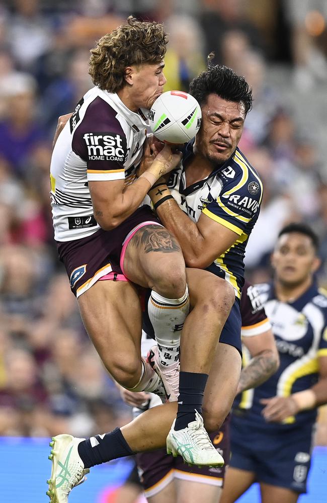 Reece Walsh of the Broncos and Jeremiah Nanai of the Cowboys contest the ball during the round 23 NRL match between North Queensland Cowboys and Brisbane Broncos at Qld Country Bank Stadium, on August 10, 2024, in Townsville, Australia. (Photo by Ian Hitchcock/Getty Images)