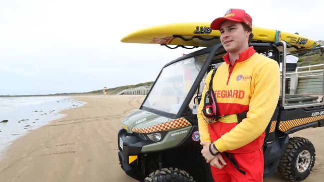 Lifeguard Edward Ford keeps watch after Ocean Grove main beach reopened about noon following a shark attack on Monday. Picture: Alan Barber