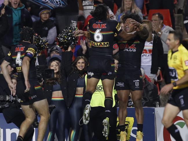 Luai and Brian To'o celebrate after To’o dives over late against the Knights. Picture: Jason McCawley/Getty Images