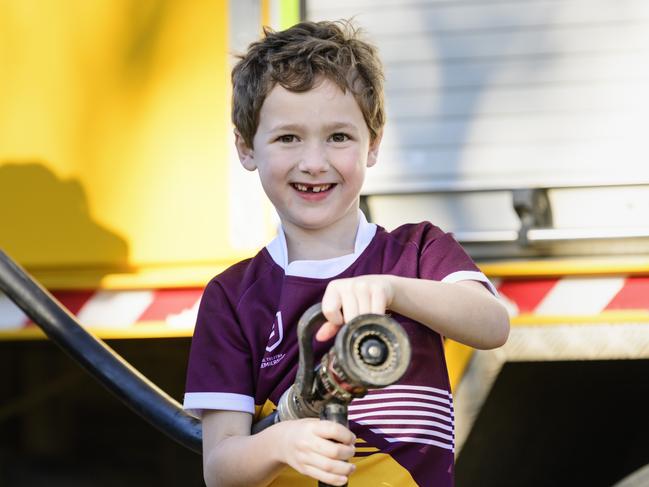 Judah Little with the fire hose from the Cambooya Rural Fire Brigade truck at Sadie's Day Out. The event, a special celebration of the life of five-year-old crash victim Sadie, was held at Cambooya State School, Saturday, June 7, 2025. Picture: Kevin Farmer