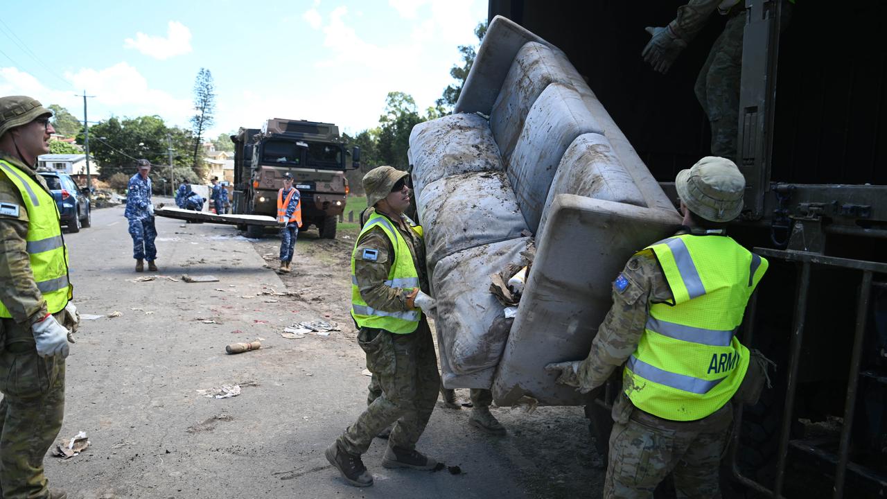 The ADF help with the clean up after floods in Goodna, west of Brisbane. Picture: NCA NewsWire / Dan Peled