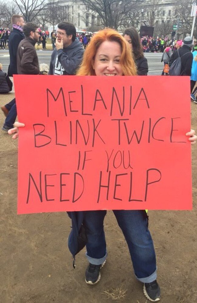 "Melania, blink twice if you need help" poster at the Women's March