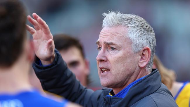 MELBOURNE, AUSTRALIA - JULY 07: Adam Simpson, Senior Coach of the Eagles talks to his players during the round 17 AFL match between Melbourne Demons and West Coast Eagles at Melbourne Cricket Ground on July 07, 2024 in Melbourne, Australia. (Photo by Graham Denholm/AFL Photos/via Getty Images)