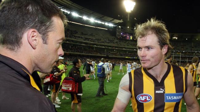 Alastair Clarkson shaking hands with Richie Vandenberg after his final AFL match.