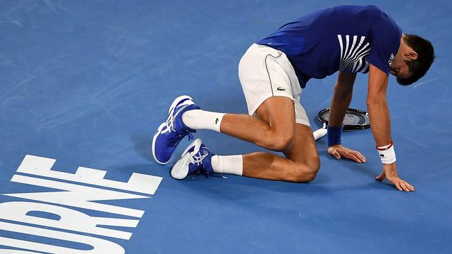 Novak Djokovic hit the deck against Daniil Medvedev in the fourth round. (Photo by William WEST / AFP) 