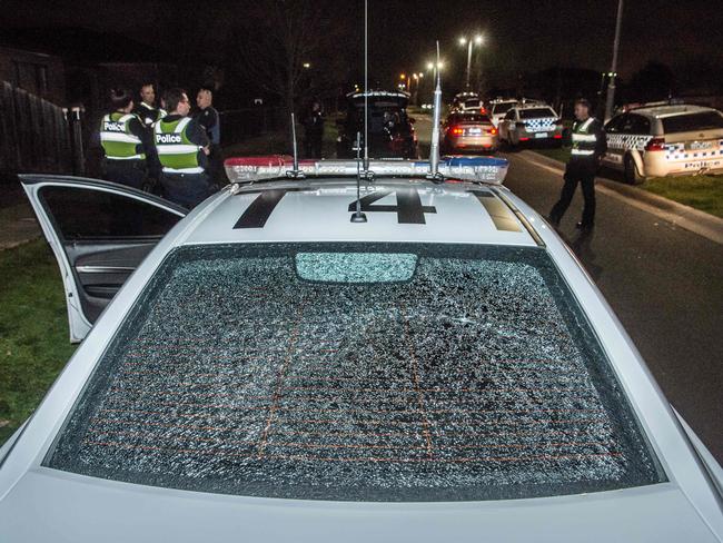 One of the “projectiles” smashed the rear window of a police car. Picture: Jason Edwards