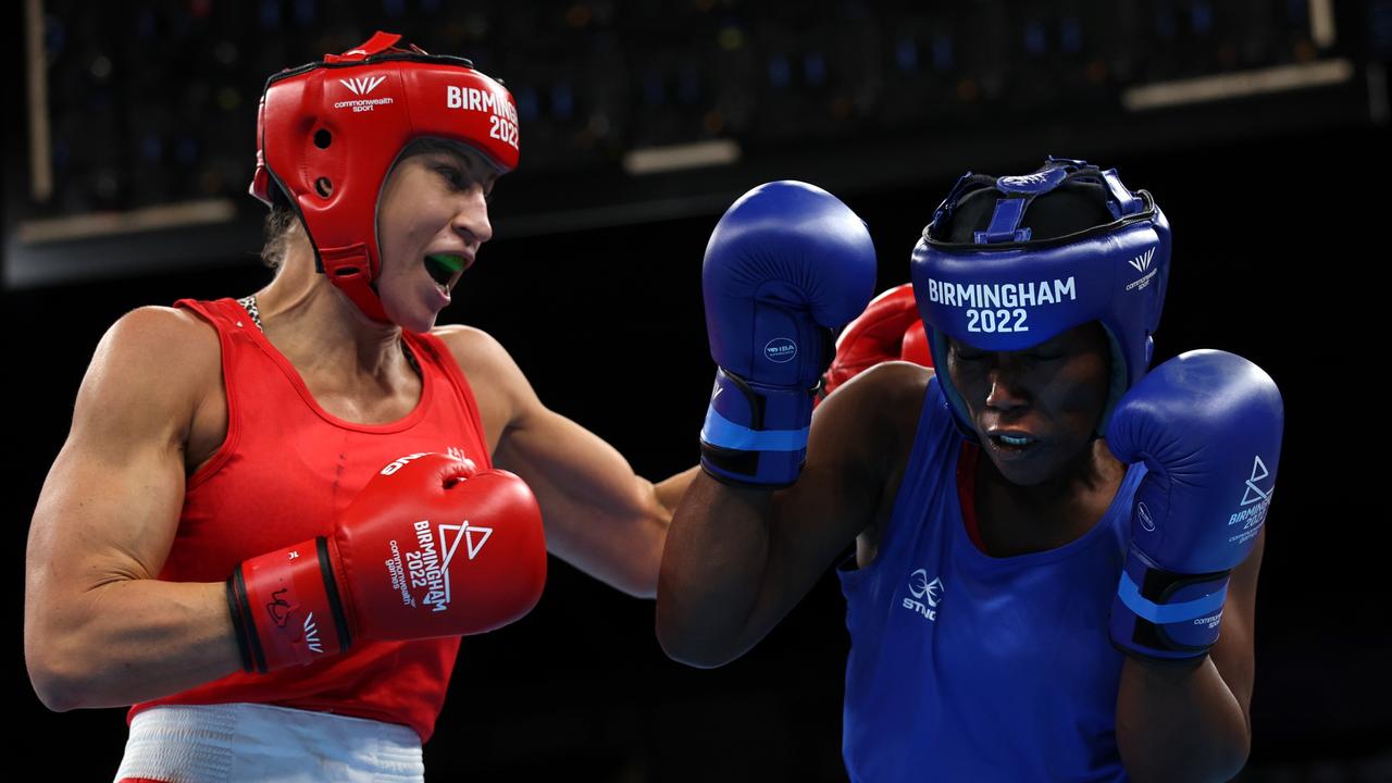 BIRMINGHAM, ENGLAND – AUGUST 03: Kaye Frances Scott of Team Australia (Red) punches Zainab Keita of Team Sierra Leone (Blue) during the Women's Over 66kg-70kg (Light Middleweight) Quarter Final fight on day six of the Birmingham 2022 Commonwealth Games at NEC Arena on August 03, 2022 in Birmingham, England. (Photo by Eddie Keogh/Getty Images)