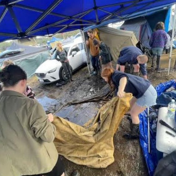 Festival goers were forced to evacuate the camping ground after they were inundated by rainfall and mud. Picture: Sam Benjamin