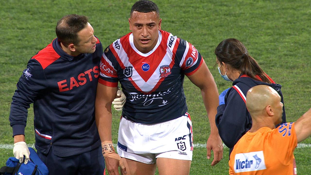 Siosiua Taukeiaho limps off for the Roosters.