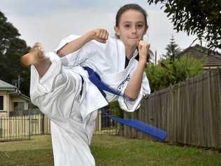 AUSTRALIAN CHAMPION: Young martial artist Ellen Camm won gold at the Australian Kyokushin Karate Championships in Brisbane recently. Picture: Bev Lacey