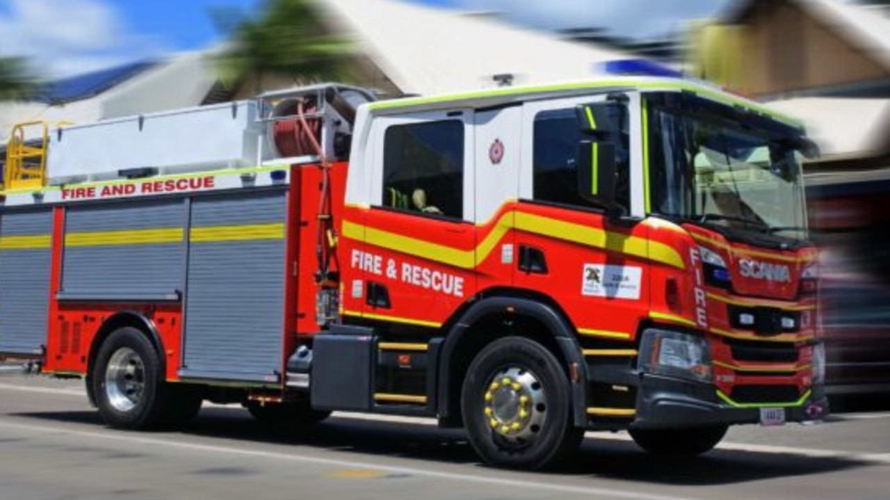 Fire engines are rushing northward up the Bruce Highway after reports of smoke in the roof of a building in a small town between Mackay and the Whitsundays.