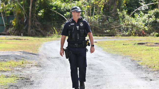 Tully Police Station Officer in Charge Sergeant Rod Stanley walks through the former Greenway Caravan Park where convicted murderer Graham Potter resided for months after fleeing Victoria. Picture: Brendan Radke