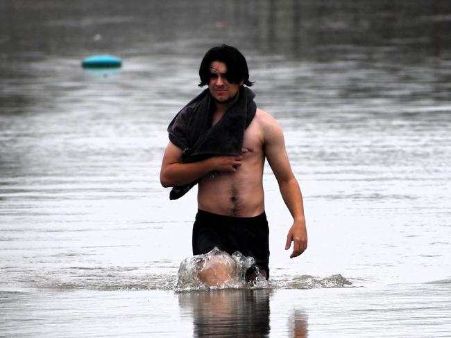 Miles Street on Sunday. Floodwaters have inundated much of Ingham, Hinchinbrook Shire, after the Herbert River breached its banks, compounding surface flooding from days of monsoonal rains. Picture: Cameron Bates