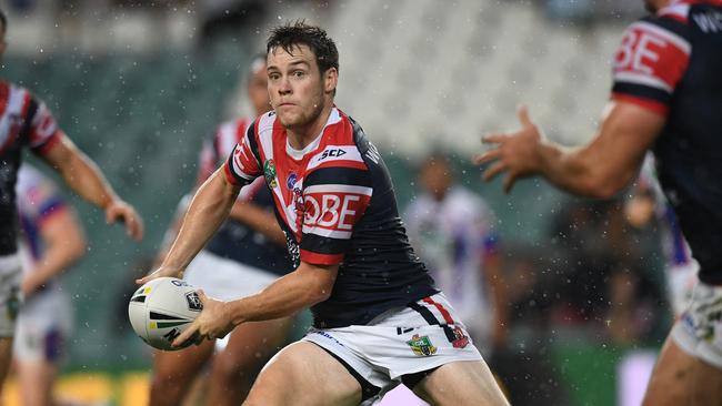 Luke Keary runs the ball for the Roosters against the Knights.