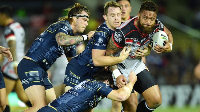 NRL Round 24 match between the NQ Cowboys and NZ Warriors, in Townsville, Queensland, Australia. Cowboy's Ethan Lowe, Michael Morgan and Rory Kostjasyn take down Warriors' Manu Vatuvei. Picture: Wesley Monts