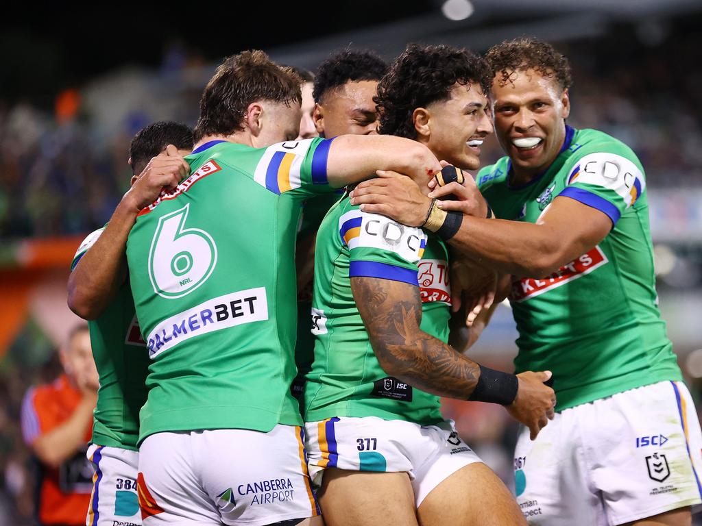 CANBERRA, AUSTRALIA - APRIL 07: Xavier Savage of the Raiders celebrates scoring a try with team mates during the round five NRL match between Canberra Raiders and Parramatta Eels at GIO Stadium, on April 07, 2024, in Canberra, Australia. (Photo by Mark Nolan/Getty Images)