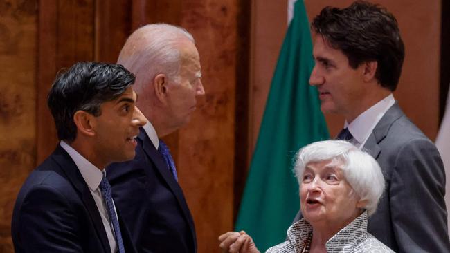 Britain's Prime Minister Rishi Sunak speaks with US Treasury Secretary Janet Yellen as US President Joe Biden speaks with Canada's Prime Minister Justin Trudeau before the start of the second working session meeting at the G20 Leaders' Summit in New Delhi on Saturday. Picture: Ludovic Marin / POOL / AFP