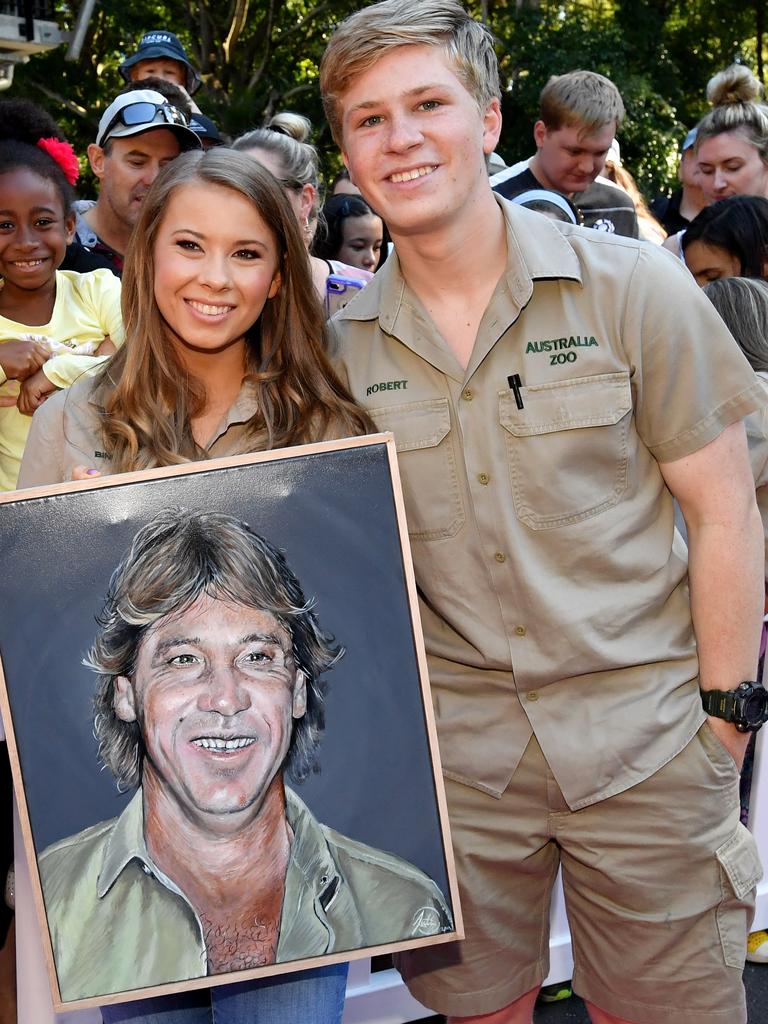 Bindi and Bob Irwin with a painting of father Steve. Picture: AAP