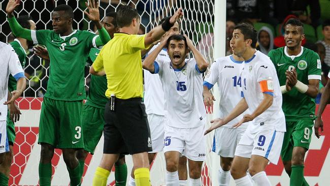 Uzbekistan v Saudi Arabia Asian Cup, Group B. at the Melbourne Rectangular Stadium, 18th January. Referee Ben Williams dissallowed goal as a shocked JASUR KHASANOV of Uzbekistan holds his head in the second half. Picture : George Salpigtidis