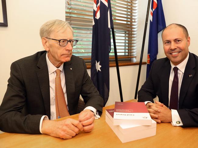 Commissioner Kenneth Hayne and Treasurer Josh Frydenberg (right) are seen with the final report from the Royal Commission into Misconduct in the Banking, Superannuation and Financial Services Industry, at Parliament House in Canberra, Friday, February 1, 2019. (AAP Image/Fairfax Media Pool, Kym Smith)