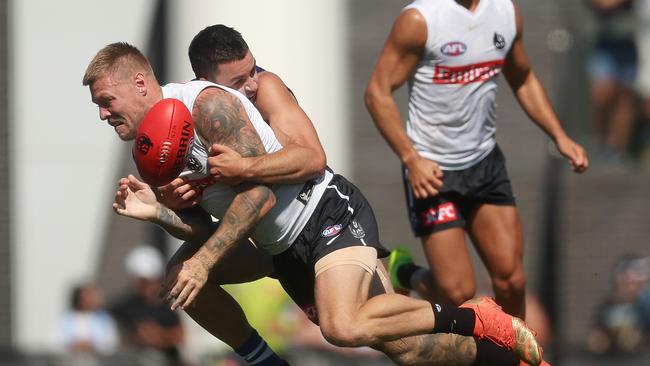 Jordan De Goey gets tackled by Luke Davies-Uniacke. Picture: Daniel Pockett/Getty Images