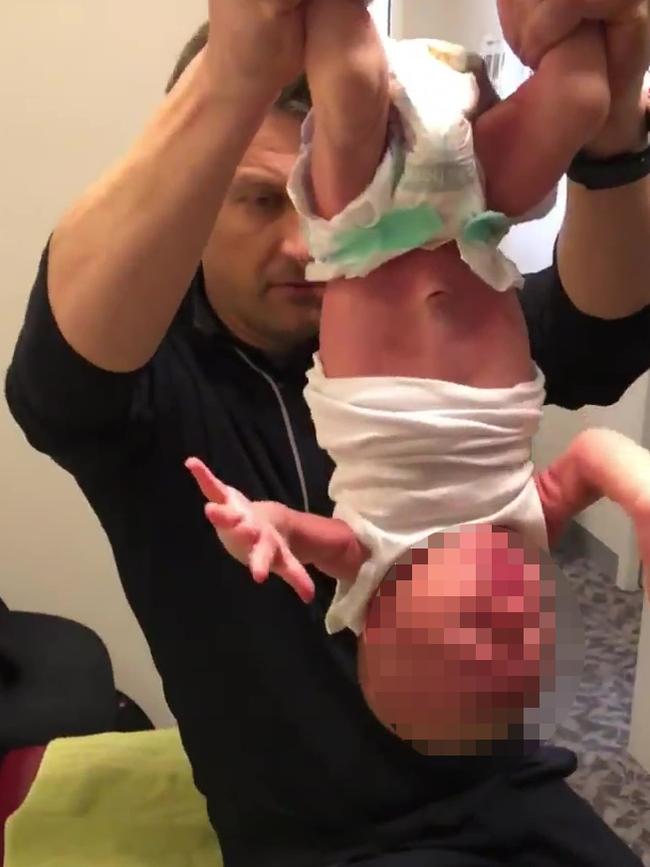 Cranbourne’s Dr Andrew Arnold has been barred from treating children under 12 after he was filmed holding an infant upside down.