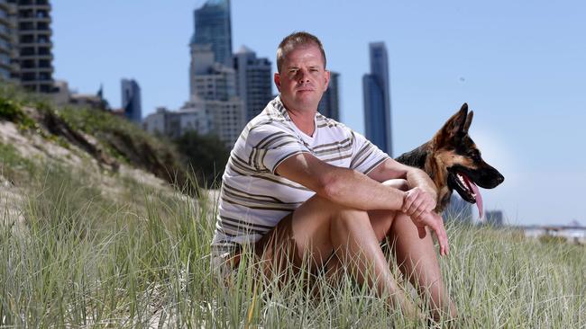 Time out: Wayne Heneker pictured a year after the robbery, with his dog, Kira. Picture: Adam Head