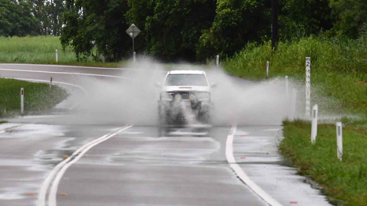 A vehicle navigates the notorious flood-prone Gairloch Washaway between Ingham and Cardwell on Wednesday morning. Picture: Cameron Bates