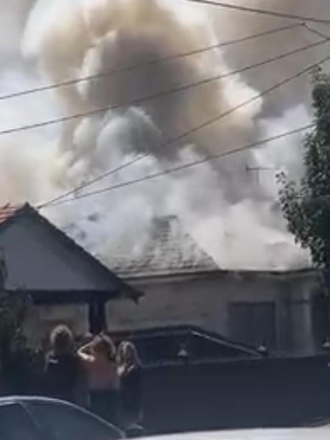 Neighbours spilled out onto the street after seeing smoke erupt from the home. Picture: Supplied