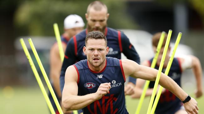 Steven May runs ahead of big man Max Gawn at Mebourne training. Picture: Darrian Traynor/Getty