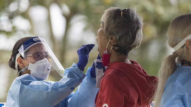 A woman takes a Covid test. Picture: Brian Cassey