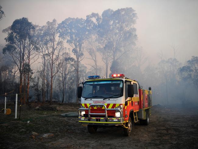 There are more than 80 fires burning around the state, with about half of those uncontained. Picture: AAP/ Dan Peled.