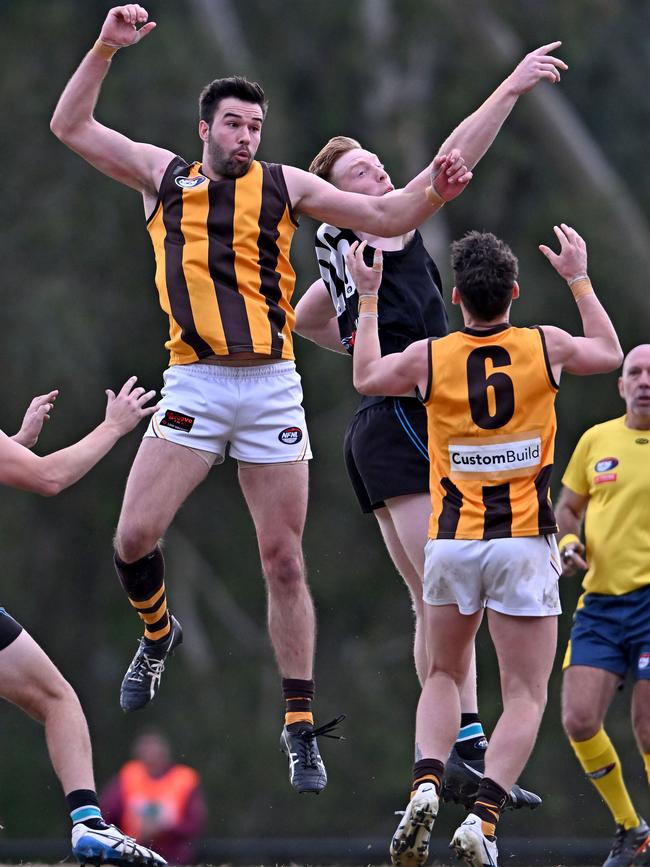 NFL: Lower Plenty’s Tom Blake and St Mary’s Huon Macgibbon jump in the ruck. Picture: Andy Brownbill