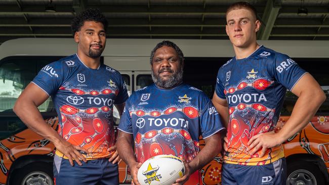 North Queensland Cowboys rugby league players Kaiden Lahrs and Jamal Shibasaki with artist Bradley Michael. Mr Michael created the ‘Nhinhinhi Gurra Bamawi Guugu’ (‘How the Giant Nhinhinhi Fish Changed the Languages)’ to be worn during Deadly Choices Round against Wests Tigers at Queensland Country Bank Stadium on Friday, May 24. Picture: Supplied