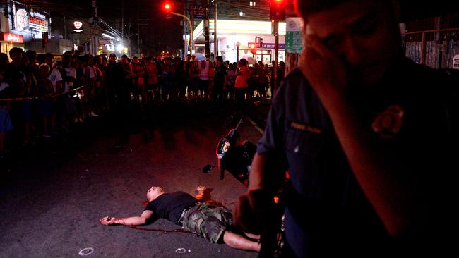 A crime scene where an alleged drug dealer was gunned down by unidentified men in Manila. Picture: AFP/ Noel Celis.
