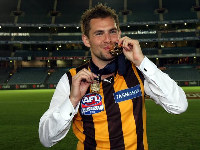 Luke Hodge with his 2008 Norm Smith and premiership medals.