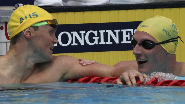 Australia's Mack Horton, right, talks with compatriot David McKeon after their men's 400m freestyle heat. Photo: AP