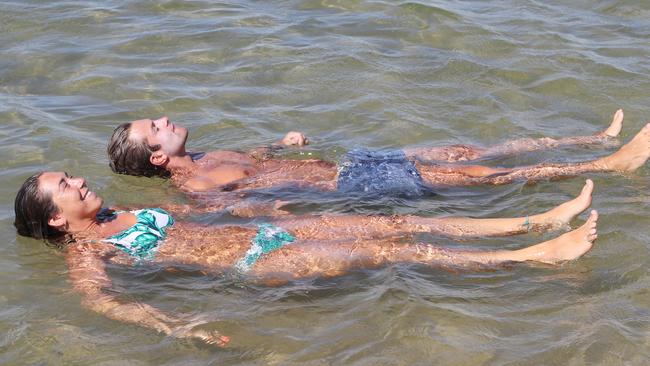 10AM: Swimmers keep cool on St Kilda beach. Picture: David Crosling