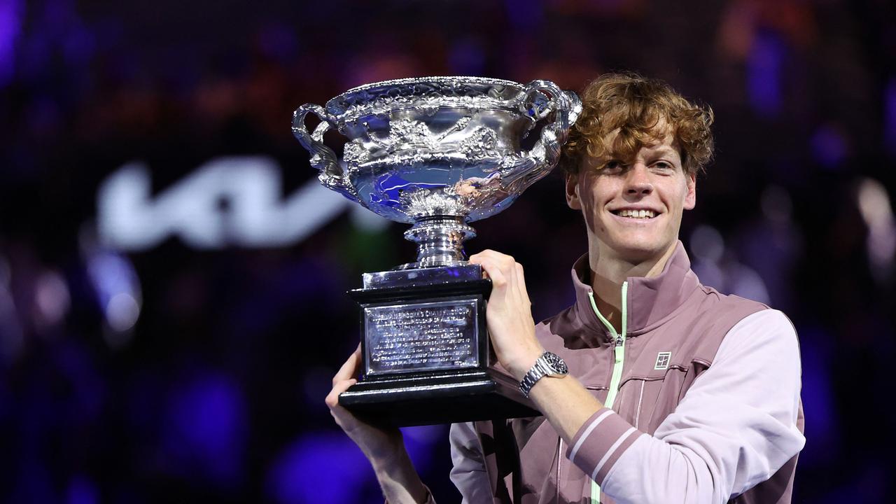 Italy's Jannik Sinner celebrates after winning the Australian Open tennis tournament in Melbourne on January 28, 2024. (Photo by Martin KEEP / AFP)