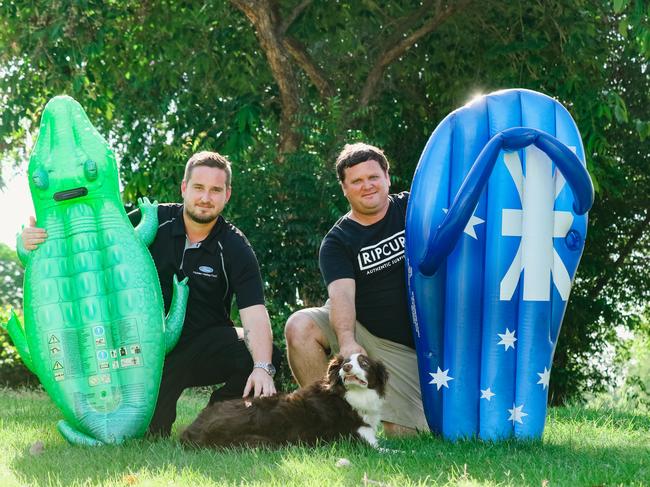 Hero dads Daniel Jipp and Chris Julian rescued Jax the Border Collie from a weed infested lake in Durack with a blow up thong and croc. Picture: Glenn Campbell