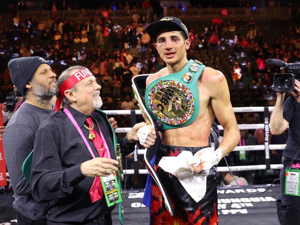 Sebastian Fundora poses with his title belts after defeating WBO junior middleweight champion Tim Tszyu. Picture: Getty