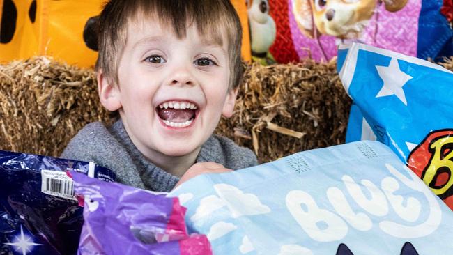 ADELAIDE, AUSTRALIA - NewsWire Photos 11th August, 2023:  Alfie (4) getting excited with show bags at the Adelaide Royal Show. Picture: NCA NewsWire / Kelly Barnes