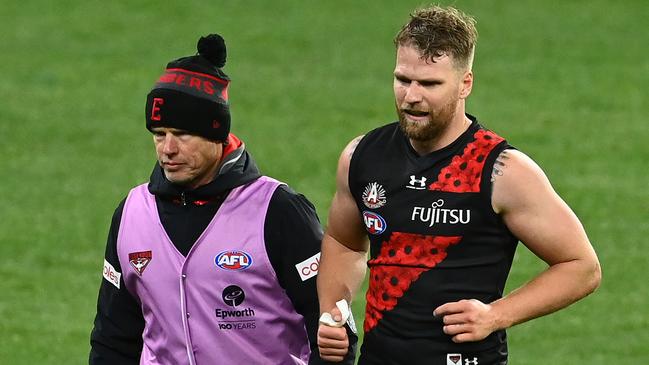 Bomber Jake Stringer walks of the MCG on Friday night. Picture: Quinn Rooney/Getty Images