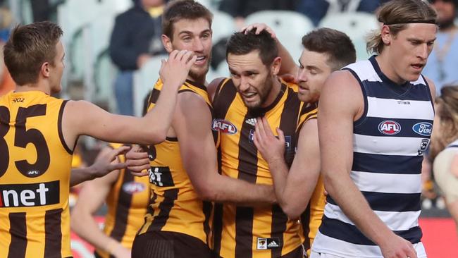 Hawthorn players celebrate a goal against Geelong. Picture: AAP Images