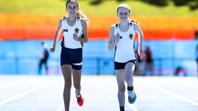 Runners from Mount St Michael’s Zelmari van Loggerenberg, 12 and Laura Bray, 12 during the CaSSSA Cup Catholic School Girls Track and Field Championship from QEII. Picture: Zak Simmonds