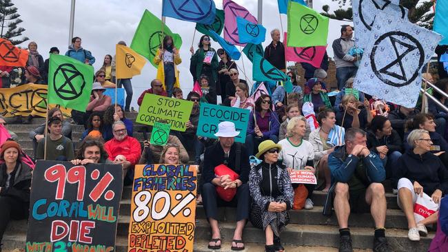 Extinction Rebellion protest at Manly, where activists put their heads in the sand. Picture: Julie Cross