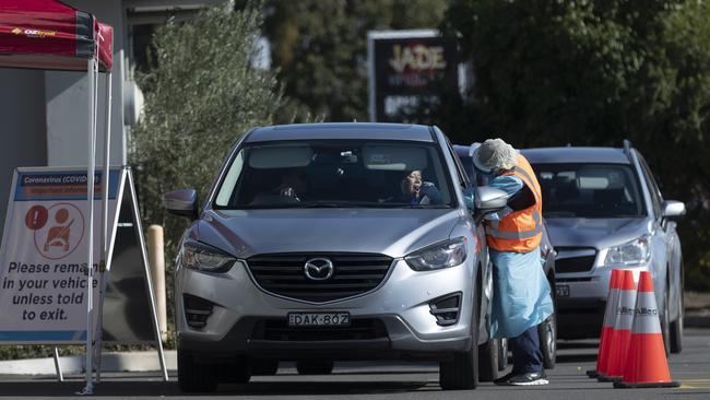 COVID-19 testing being carried out at the Crossroads Hotel in Casula on July 13.