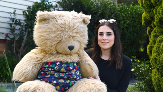 Gympie Times Journalist Maddie Manwaring with Teddy Bear on Pine St