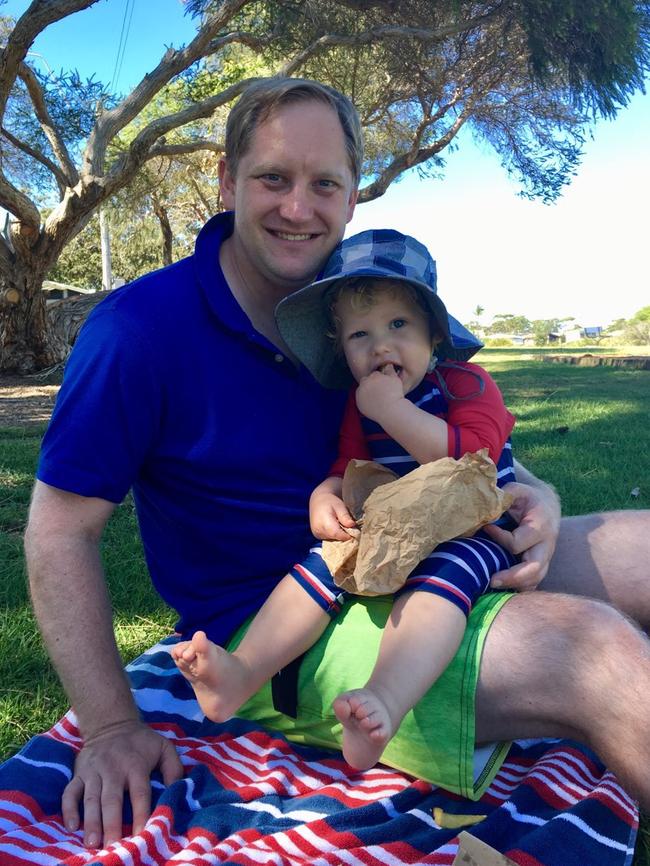 Tim Lendrum, of Castle Hill, pictured with his son George, helped save the life of a seven-year-old girl who nearly drowned in Narrabeen Lagoon.